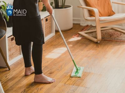 woman is mopping the floor